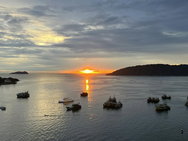 Fishing boats on the water at sunset off Kota Kinabalu