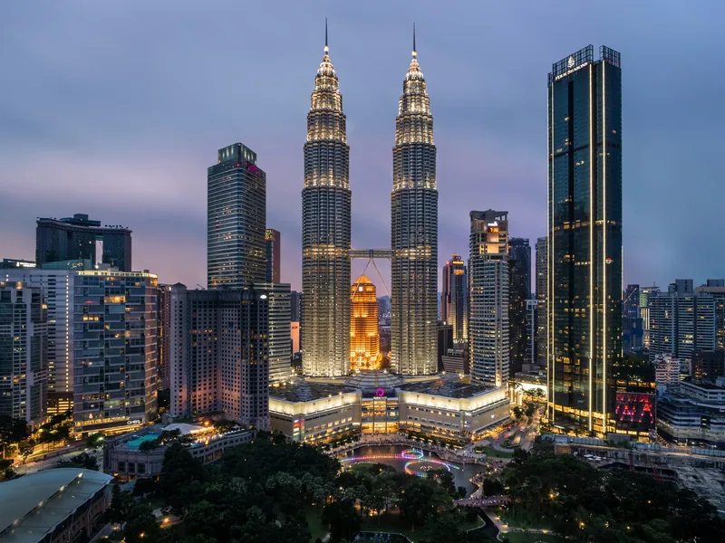 Kuala Lumpur skyline at dusk, home of the biggest tattoo scene in Malaysia