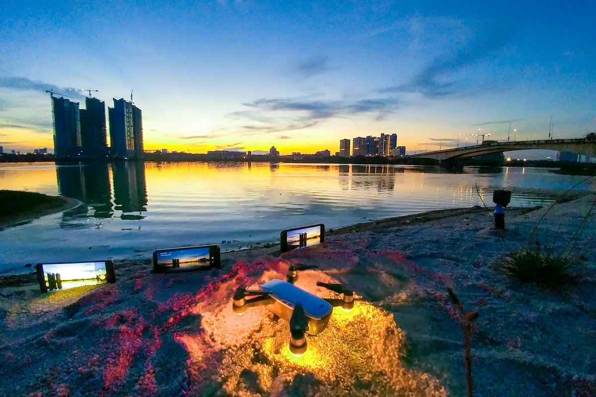 High-rise towers along a waterfront at sunset
