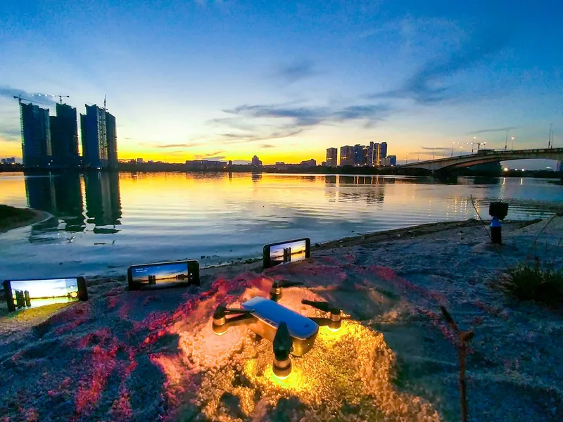 High-rise towers along a waterfront at sunset